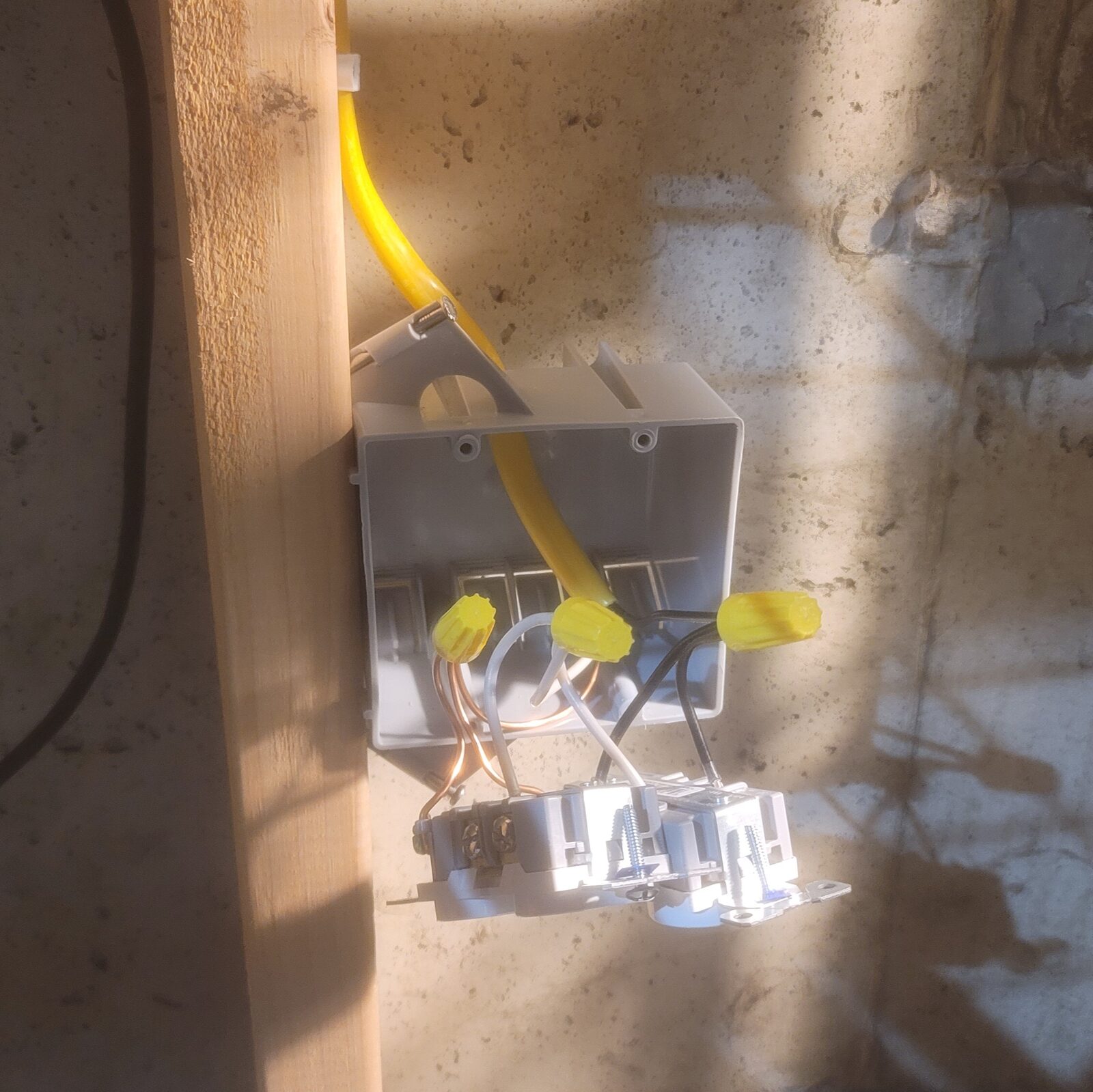 The last box of four in warm afternoon light, receptacles wired & hanging below